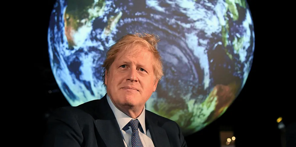 Britain's Prime Minister Boris Johnson reacts during an event to launch the United Nations' Climate Change conference, COP26, in central London.