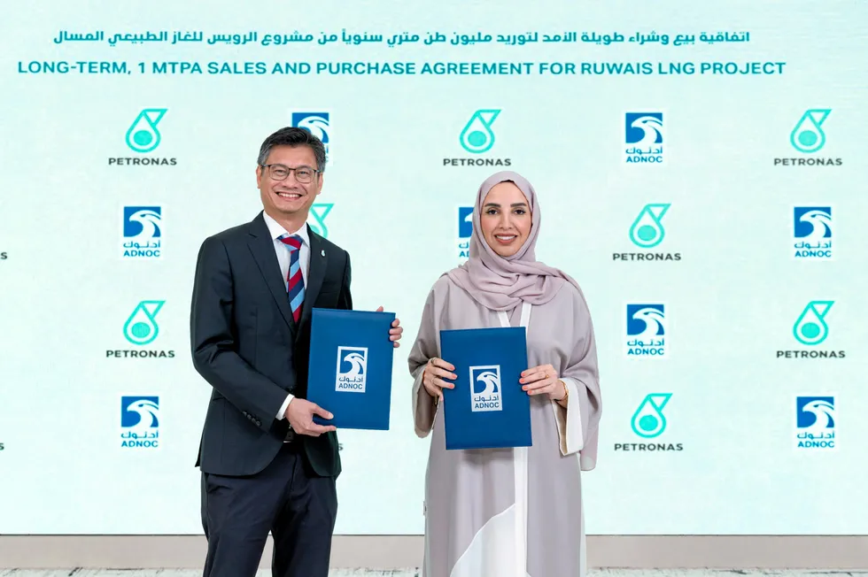 Adnoc and Petronas officials signed the LNG sales and purchase agreement.