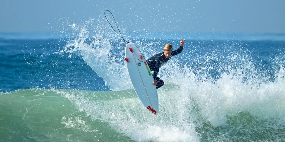 An iconic image of a surfer off California - but will the state's floating wind sector see lift-off?
