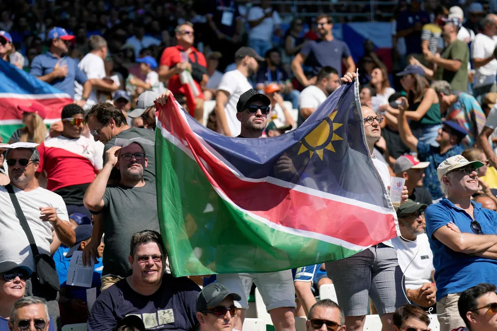 Namibia supporters wave their national flag ahead of a Rugby World Cup match in 2023 in France.