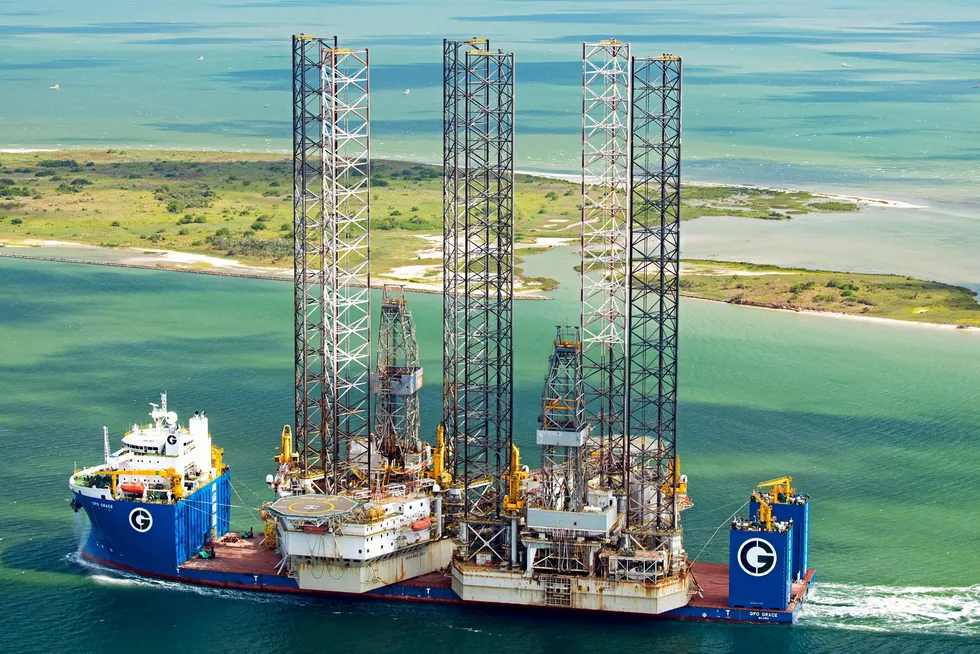 Sold: Aban Offshore has divested the jack-up Deep Driller 1 pictured with the Deep Driller 7 on board the GPO Heavylift vessel GPO Grace