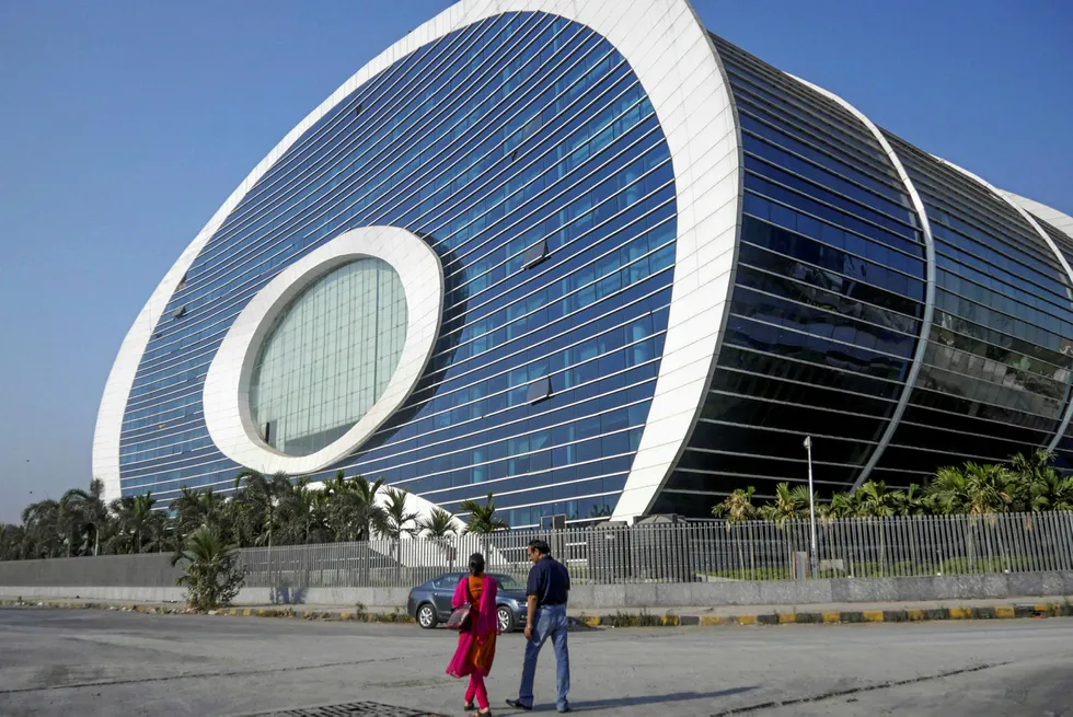 Commissioning: people walk outside an ONGC office in Mumbai, India