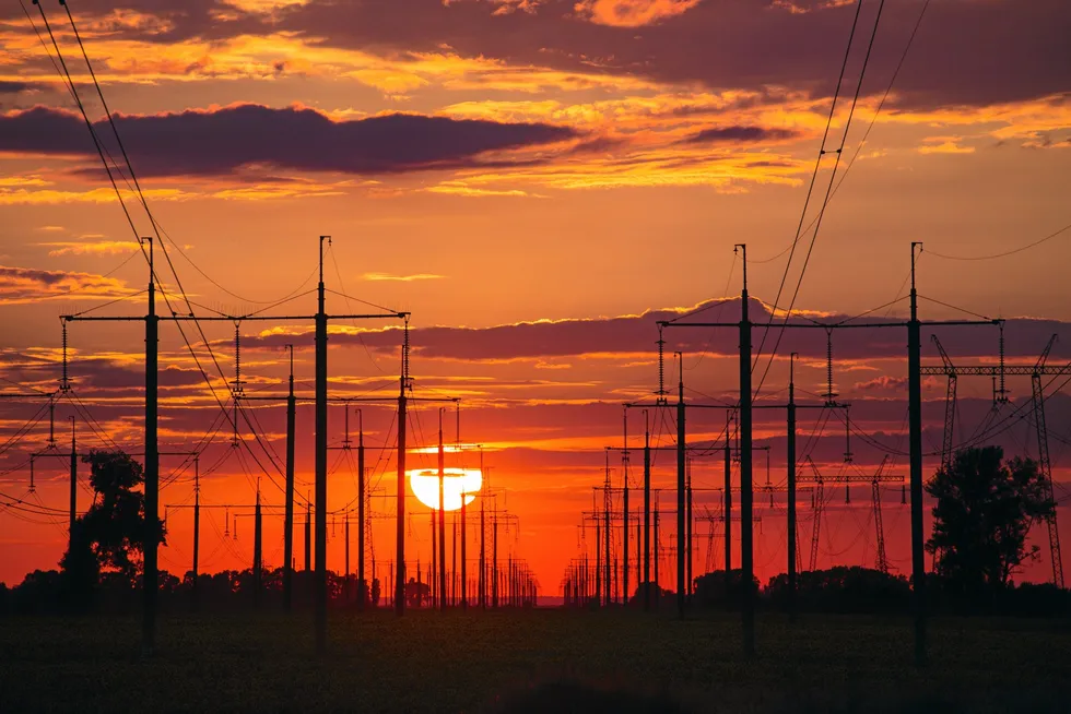 Sunset above high voltage power lines