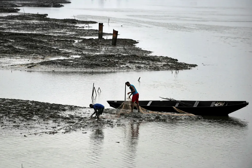 Ten years on: fishermen at the Bodo River, devastated by oil pollution, in the Gokana district of Ogoniland, southeast Nigeria