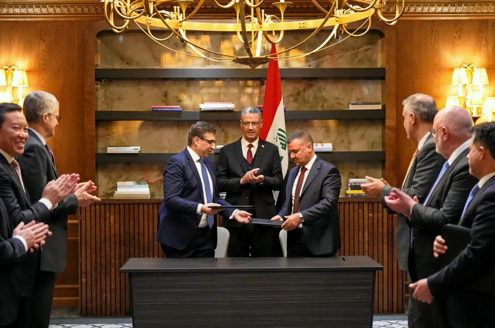 Iraqi Prime Minister Hayan Abdul Ghani Al-Sawad and BP’s Iraq branch manager Zaid Al-Yasiri sign a memorandum of understanding for the Kirkuk redevelopment in London on 14 January.