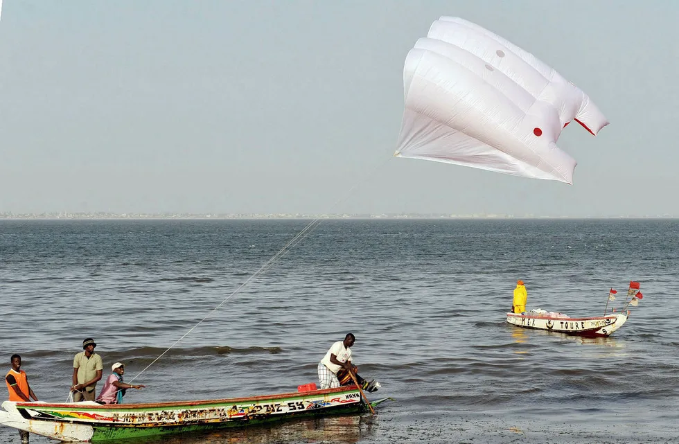 Good direction: using a kite to pull a canoe in Dakar. Senegal
