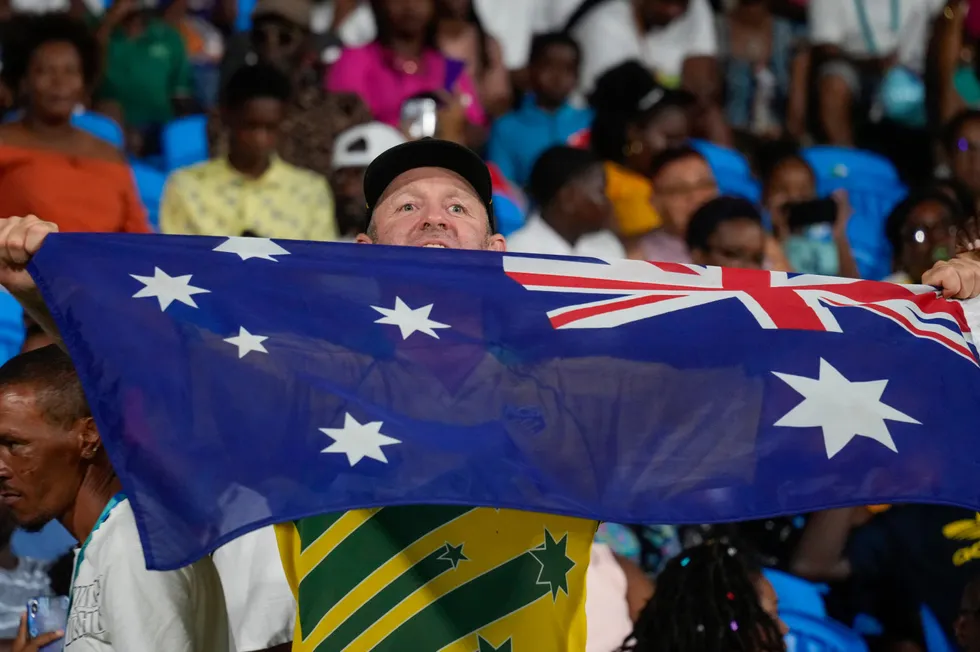 An Australian supporter waves his flag during the men's T20 World Cup cricket match between Afghanistan and Australia