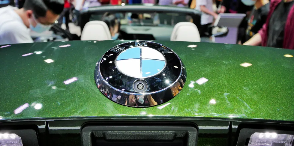 People look at a BMW car during the 18th Guangzhou International Automobile Exhibition at China Import and Export Fair Complex on November 23, 2020 in Guangzhou, Guangdong Province of China.