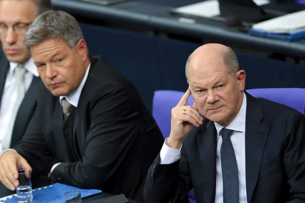 German Chancellor Olaf Scholz (R), Economy and Climate Action Minister Robert Habeck look sombre in the fading days of the last German coalition government.,
