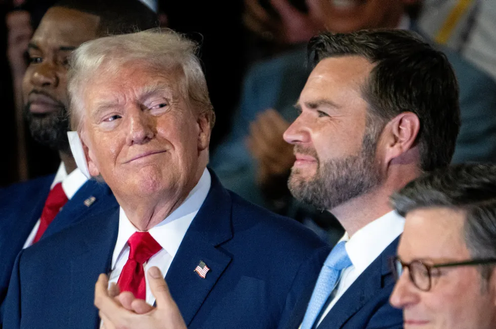 Former President Donald Trump sits with Vice-President nominee Sen. J.D. Vance, R-Ohio, at the Republican National Convention on Monday.