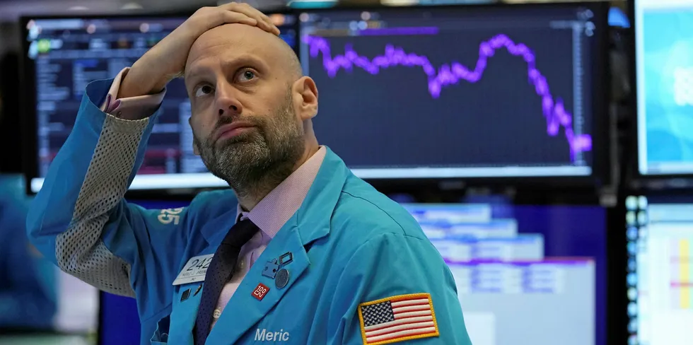 A trader at the New York Stock Exchange before trading was halted on 9 March.