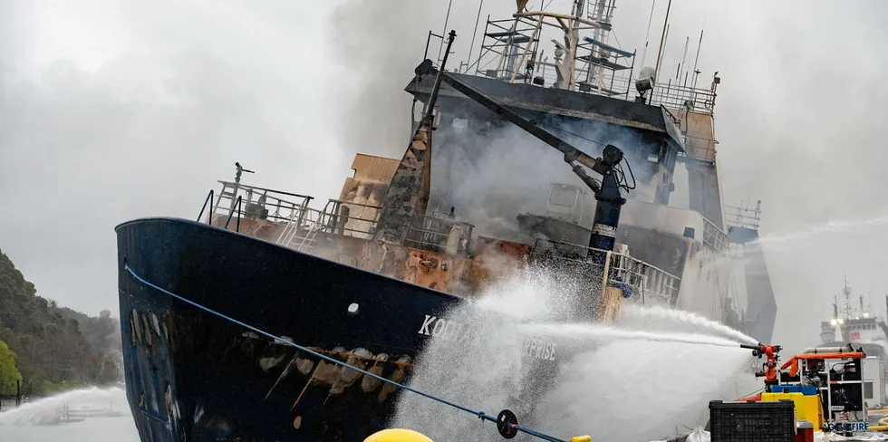 Trident Seafoods' Kodiak Enterprise on fire in the Hylebos Waterway in Tacoma, Washington in this month. Picutred above: water being sprayed on the hull of the Kodiak Enterprise.
