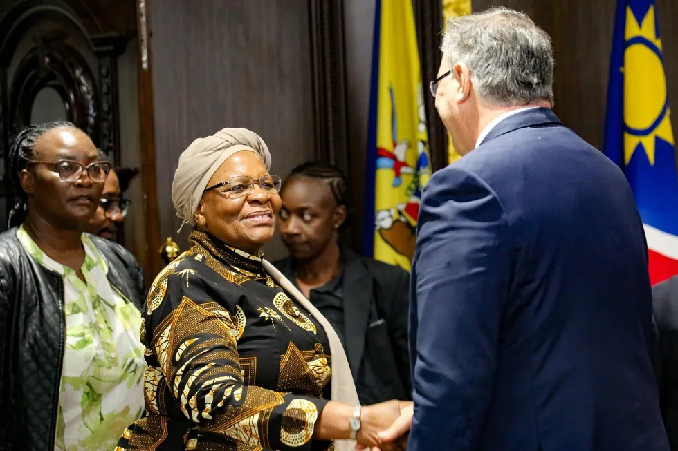 Namibia's President Netumbo Nandi-Ndaitwah greets TotalEnergies chief executive Patrick Pouyanne.