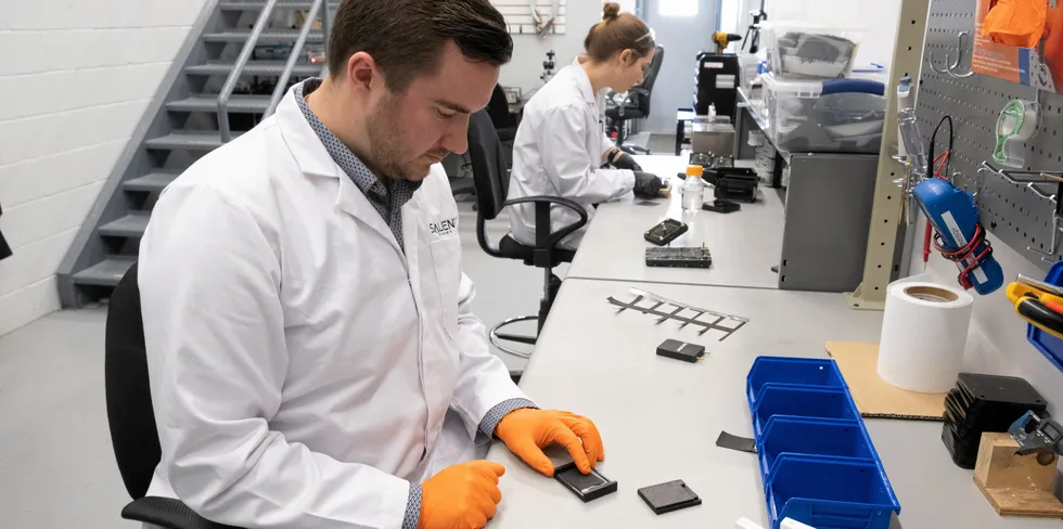 A Salient Energy technician with one of its zinc-ion battery cells at the company's facility in Halifax, Nova Scotia.