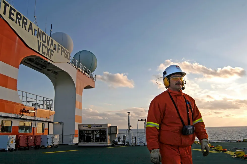 Revived: A worker on the helideck of Suncor Energy's Terra Nova FPSO which — now upgraded — has restarted production offshore Newfoundland, Canada.