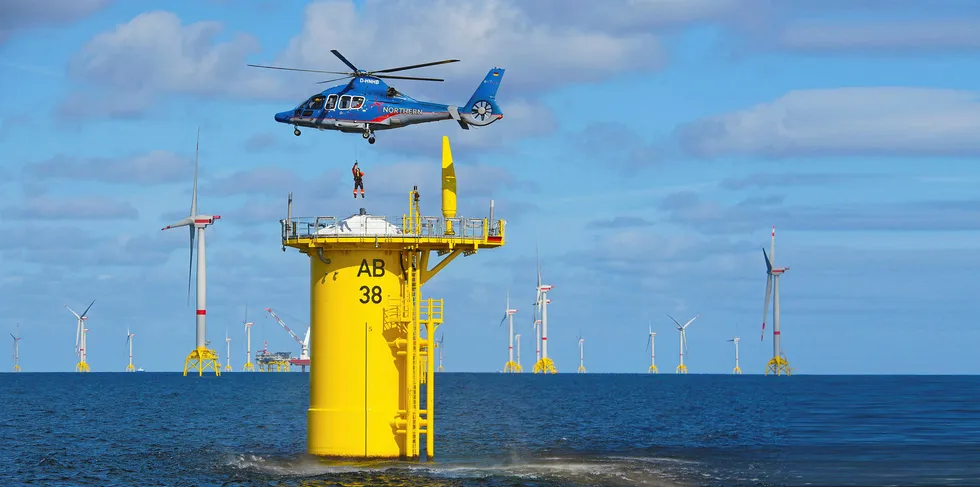 Rescue helicopter practice landing at the Arkona offshore wind farm in the Baltic Sea operated by Equinor and E.On