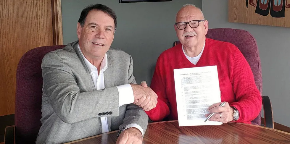 Jim Parsons, left, then general manager of Cooke Aquaculture Pacific, and Ron Allen, Tribal Council Chair/CEO of the Jamestown S’Klallam Tribe, signing the partnership agreement, in October of 2019.