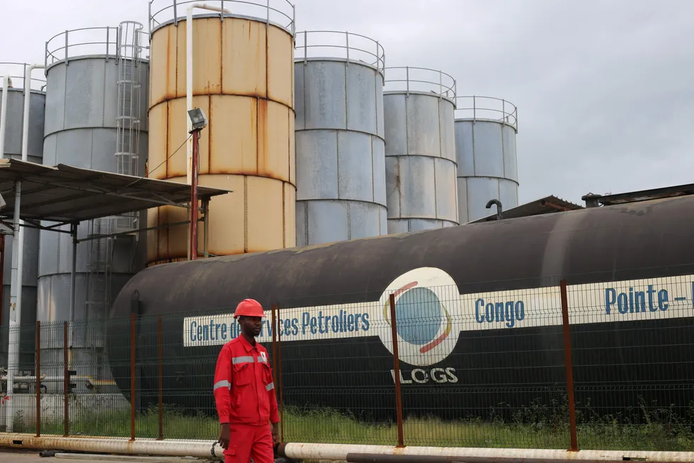 Nearby: a worker at an industrial complex in Pointe Noire, Congo-Brazzaville, close to NewAge's proposed Nene Extension project
