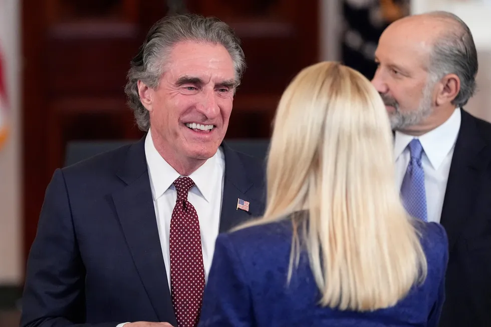 Department of the Interior (DoI) Secretary Doug Burgum talks with Attorney General Pam Bondi before US President Donald Trump speaks about investing in America in the Cross Hall of the White House on Wednesday, 30 April 2025 in Washington.