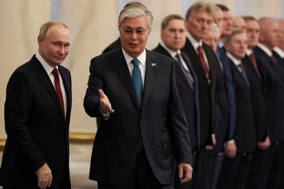 Welcome home: Russian President Vladimir Putin (left) and his Kazakh counterpart Kassym-Jomart Tokayev (centre).