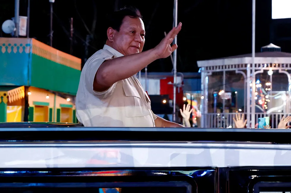 Indonesia's President Prabowo Subianto greets people on New Year's Eve in Jakarta, Indonesia.