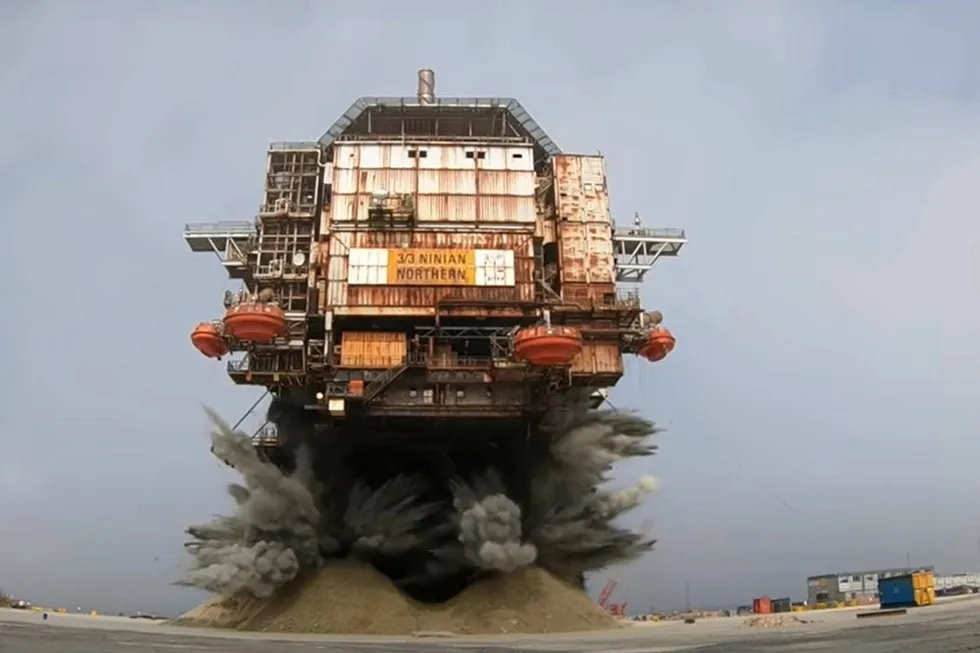 Dramatic moment: the legs being blown off CNR International's Ninian North platform in a decommissioning yard in Scotland, in the UK.