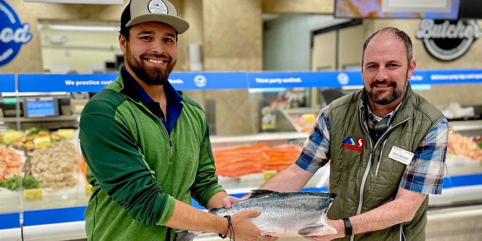 Lusamerica staffer Peter Adame last year handed off Copper River sockeye salmon to Safeway’s Meat and Sales Manager Kevin Oliphant at their Bellevue location.