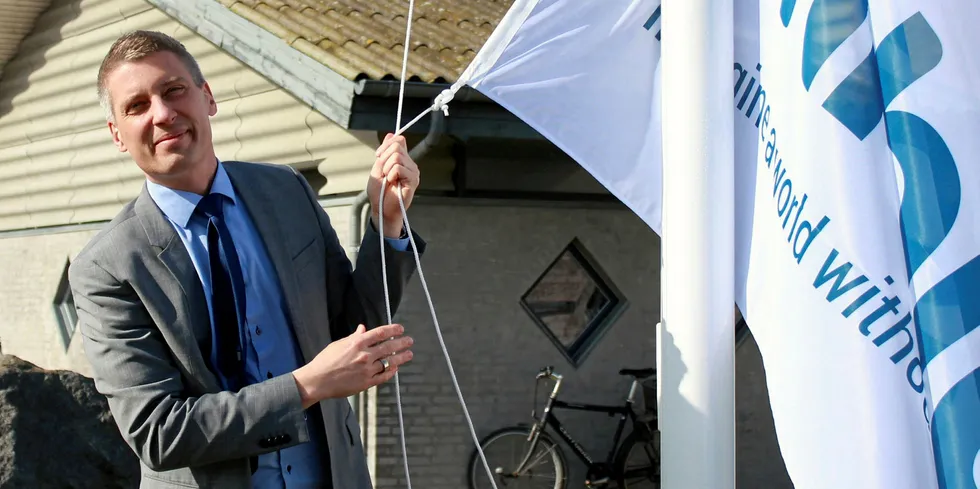Unibio CEO Henrik Busch Larsen raising the flag in Kalundborg.