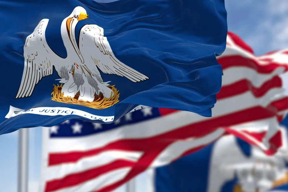 The Louisiana state flag waving along with the national flag of the United States of America.