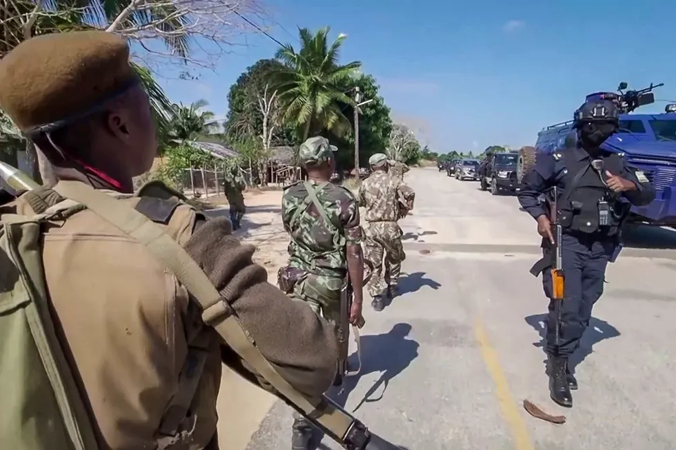 Stability sought: a Rwandan policeman (right) and Mozambican military (left) patrol near the Amarula Palma hotel in Palma, Mozambique close to the Mozambique LNG construction site