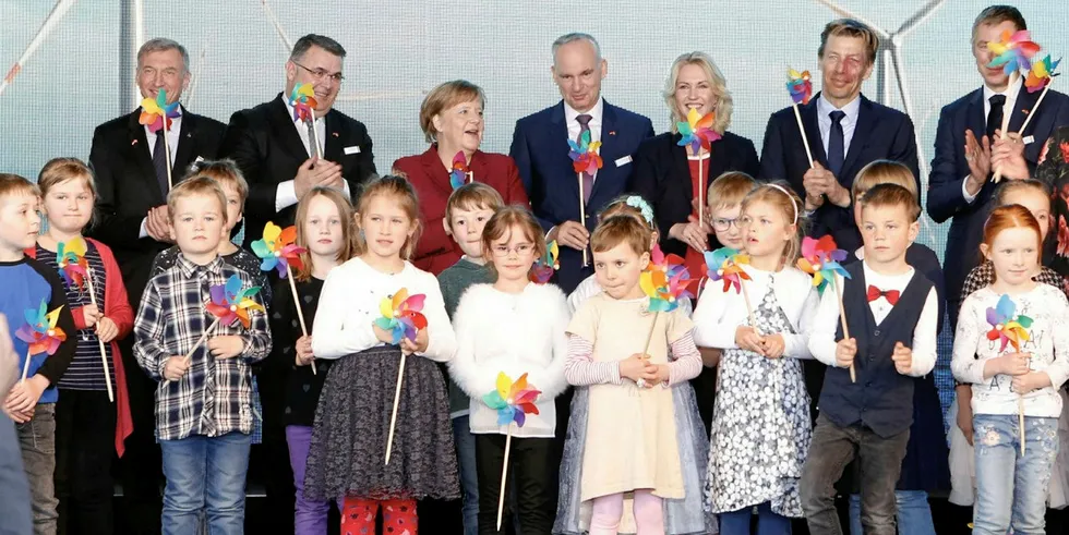 German Chancellor Angela Merkel, the CEO of E.ON and children at the Arkona inauguration