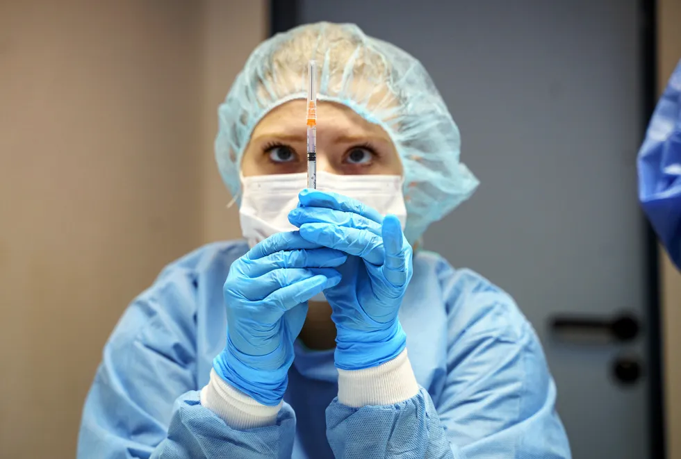 At the sharp end: a staff member prepares a vaccine shot at a centre in Mainz, Germany