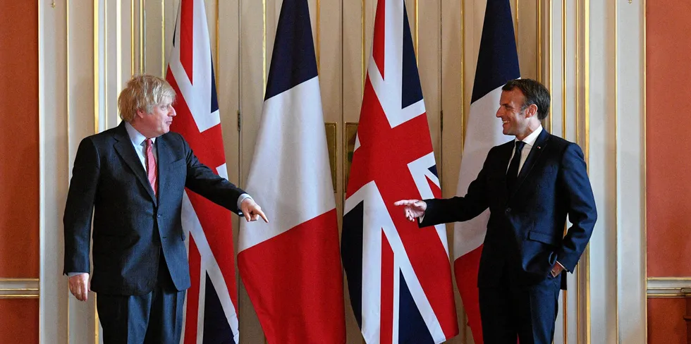 French President Emmanuel Macron (R) and Britain's Prime Minister Boris Johnson.