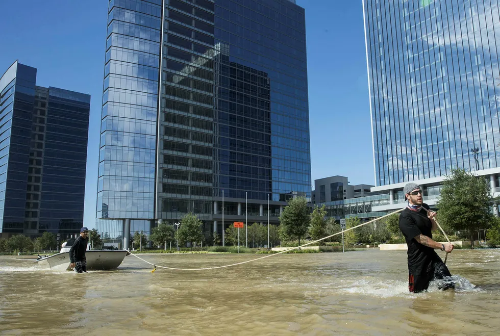 Harvey aftermath: Rescuers work on 30 August in the Energy Corridor area of Houston