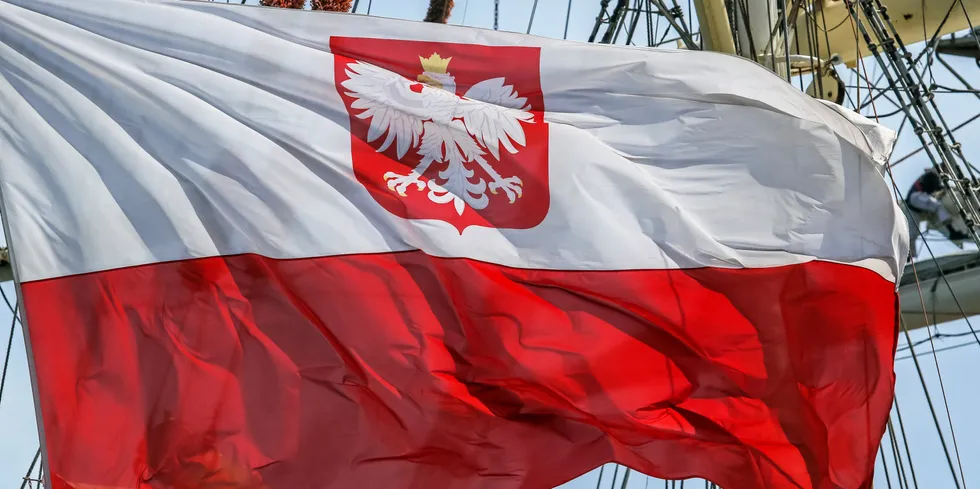 Polish flag on the STS Dar Mlodziezy sail training ship in the port of Gdynia.