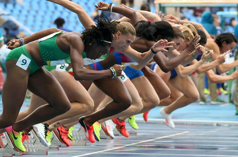 Fired-up: Uhunoma Osazuwa of Nigeria (left) competes in the heptathlon 100-metre hurdles at the Olympics in Brazil in 2016.