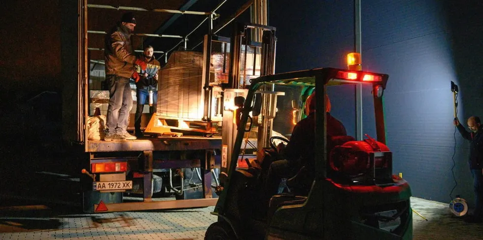 Logistics workers load aid on trucks for Ukraine as part of the Doctors Without Borders program.
