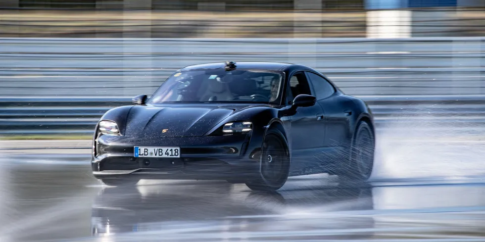 Porsche Taycan e-model speeding through Germany's Hockenheimring