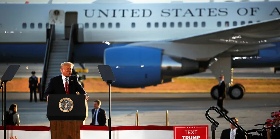 President Donald Trump speaks at a rally at an airport hanger in New Hampshire.