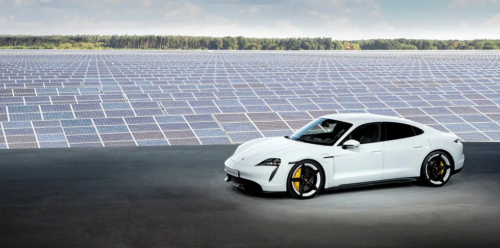 The new Porsche Taycan at a PV array in Germany.
