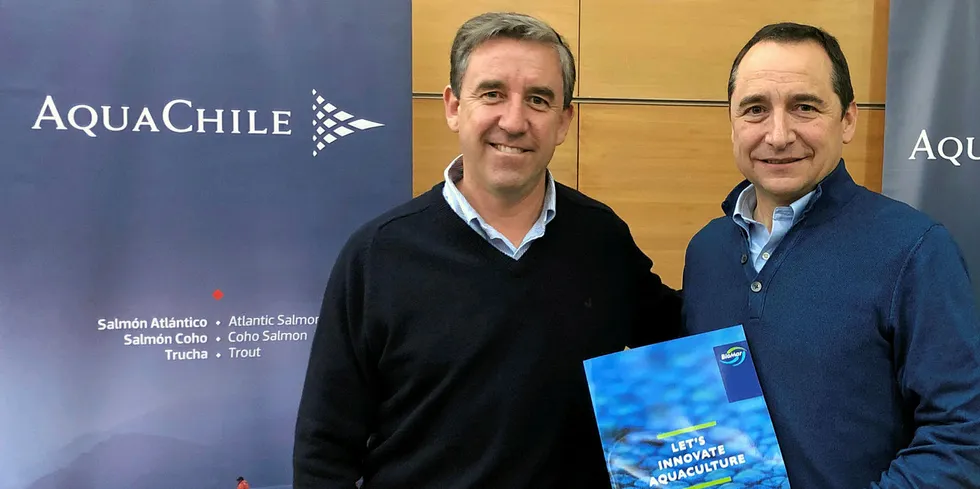 AquaChile CEO Sady Delgado with BioMar's Eduardo Hagedorn.