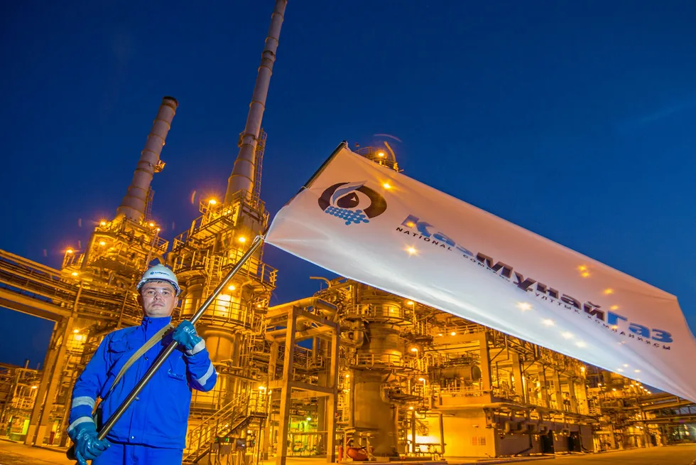 Payroll: an employee waves a KazMunaygaz flag at the Atyrau oil refinery in Kazakhstan