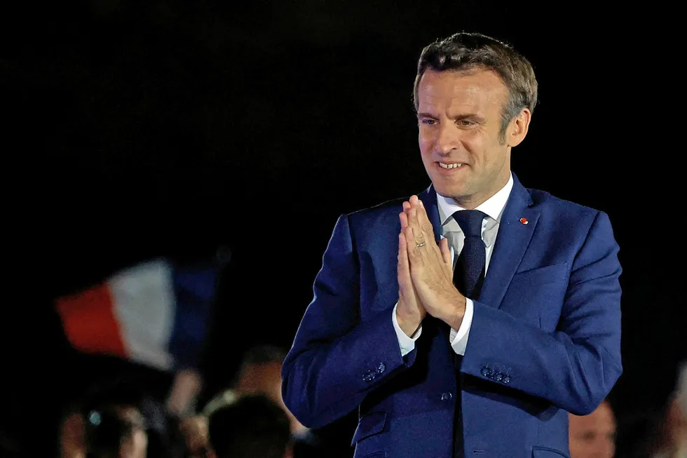 Victory: French President Emmanuel Macron reacts to his re-election on 24 April in Paris