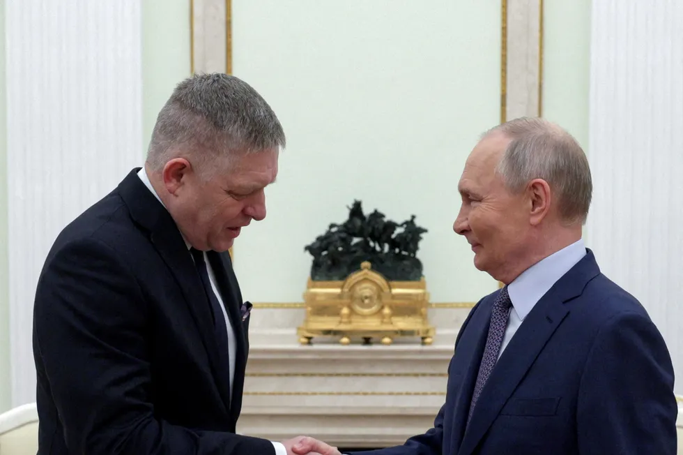 Russian President Vladimir Putin shakes hands with Slovak Prime Minister Robert Fico during a meeting in Moscow, in December.