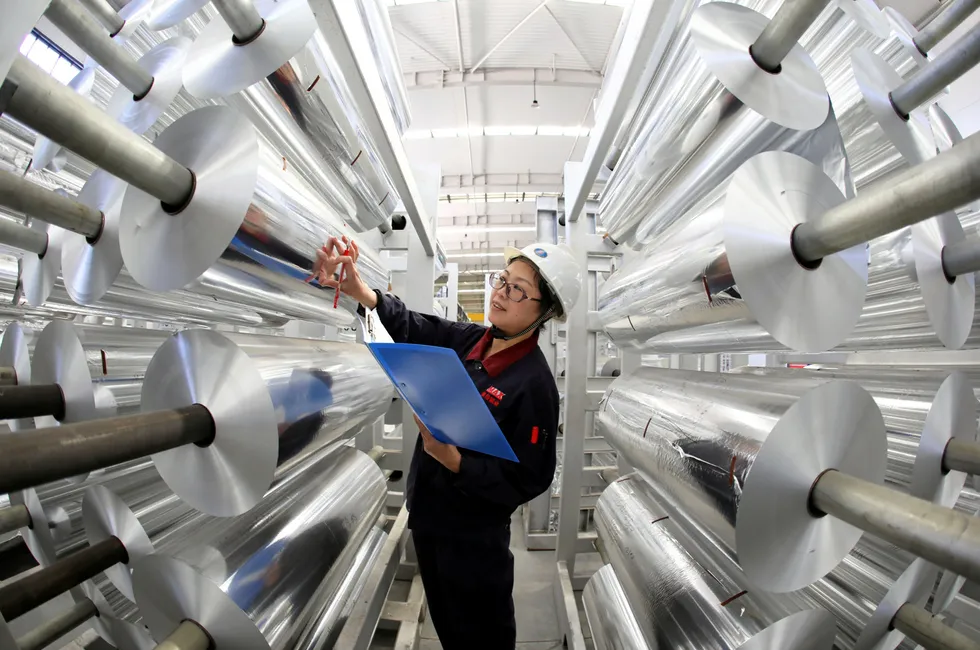 An employee works at an aluminium products factory in Huaibei, Anhui Province of China.