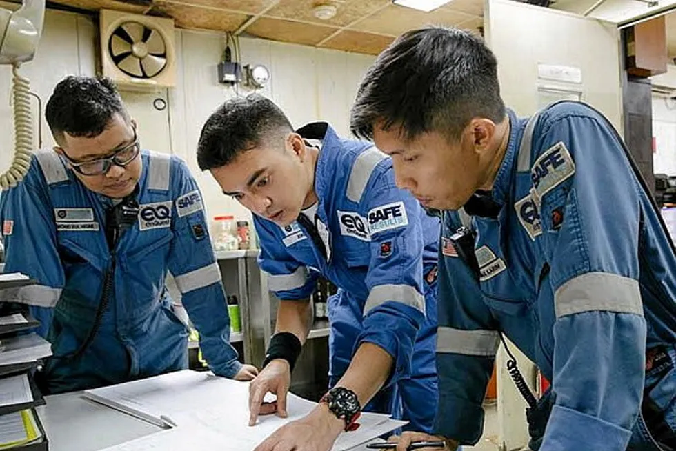 Teamwork: EnQuest workers offshore Malaysia