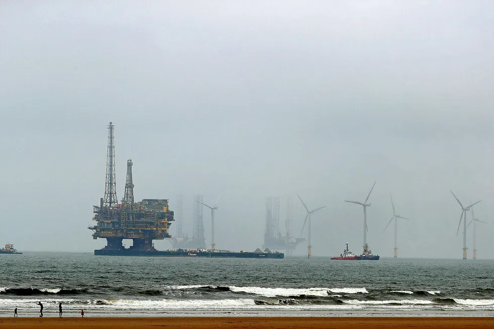Out of action: Shell's Brent Delta platform being towed to port for decommissioning in May