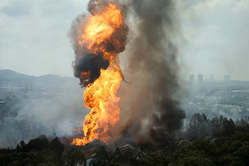 Flames and smoke rise from the 1 April fire on a gas pipeline operated by Malaysia's Petronas Gas.