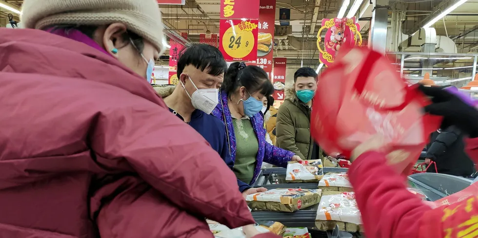 COVID-19 cases surge in Beijing, allegedly linked to salmon.
