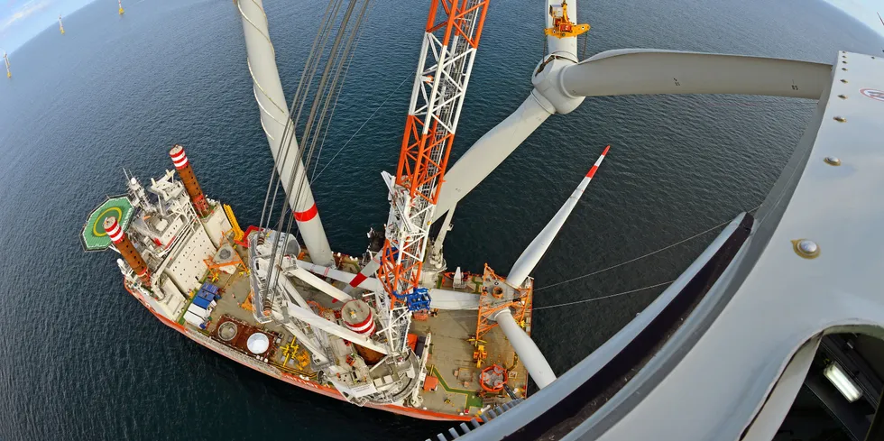 A Fred Olsen Windcarrier vessel working on an offshore wind farm.